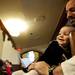 Seventeen-month-old Claire Warner sits with her father Neil at the Sing Along With Santa event on Saturday. Daniel Brenner I AnnArbor.com